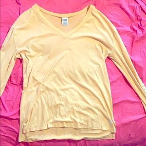 A yellow v-neck shirt